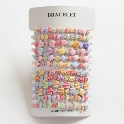 Card of 12 children's resin bracelets, multi coloured, 3 designs mixed per card. (£3.50)